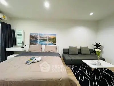 Modern bedroom with stylish decor and cozy seating area