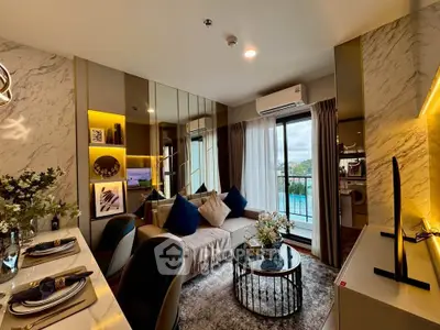 Luxurious modern living room with elegant decor and balcony view.