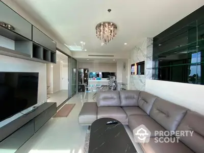 Luxurious modern living room with sleek furniture and elegant chandelier