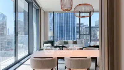 Luxurious modern living room with floor-to-ceiling windows and stunning city views.