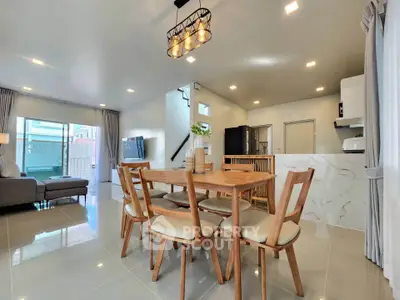 Spacious modern living room with open kitchen and elegant dining area
