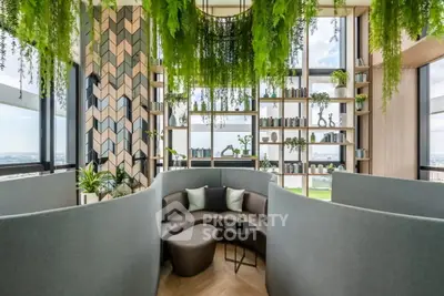 Luxurious modern living room with panoramic city views and lush greenery