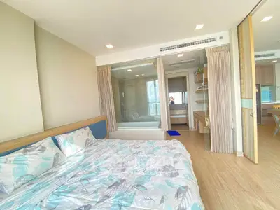 Spacious modern bedroom with ensuite bathroom and stylish decor