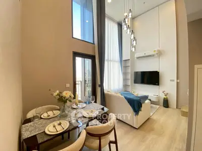 Luxurious high-ceiling living room with elegant dining area and modern decor