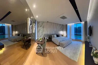 Luxurious modern bedroom with elegant decor and large windows offering stunning views.