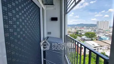 Stunning balcony view with cityscape and mountains, perfect for relaxation.