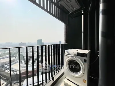 High-rise balcony with washing machine and stunning city view