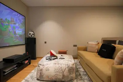 Modern living room with gaming setup and stylish decor