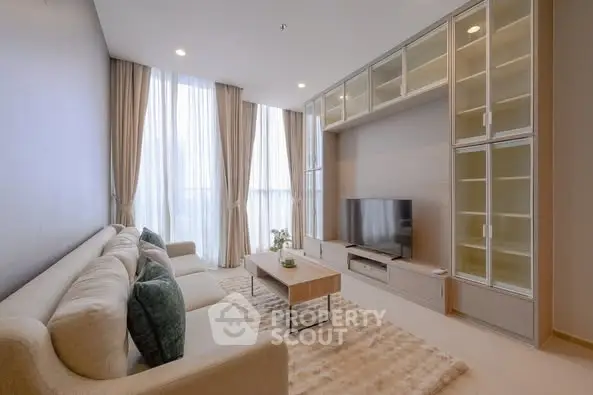 Spacious modern living room with elegant decor and large windows