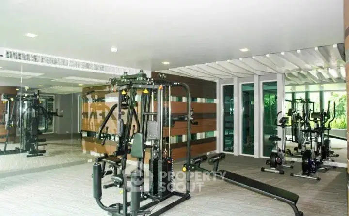 Modern gym with state-of-the-art equipment in a luxury residential building.