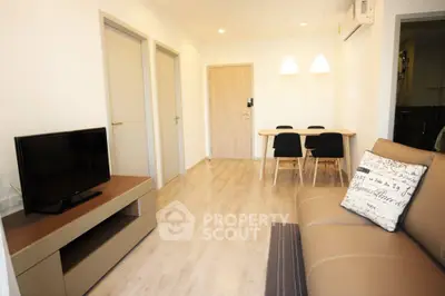 Modern living room with stylish furniture and dining area in a cozy apartment