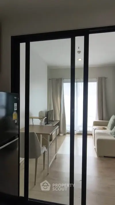 Modern living room with sliding glass doors and natural light