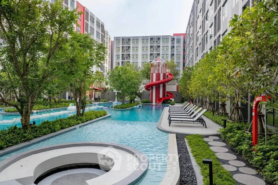 Luxurious apartment complex with stunning pool and lush greenery