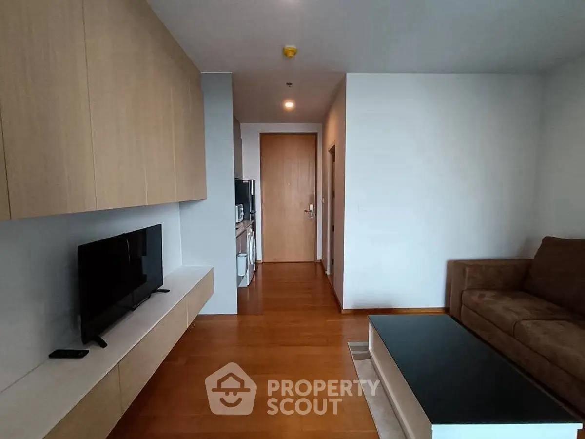 Modern living room with sleek furniture and wooden flooring