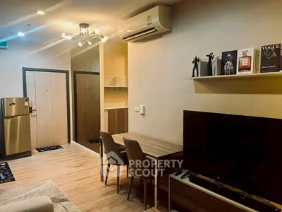 Modern living room with stylish decor, air conditioning, and sleek furniture in a cozy apartment.
