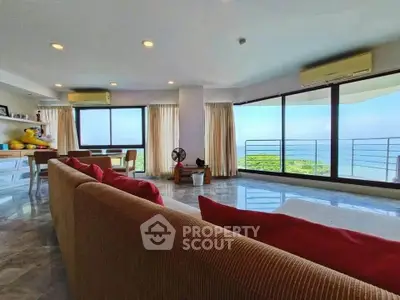 Spacious living room with panoramic ocean view and modern decor