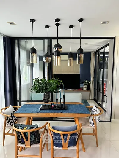 Modern dining area with stylish pendant lights and elegant decor