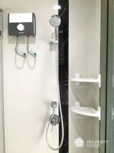 Modern bathroom with sleek shower fixtures and water heater installation.