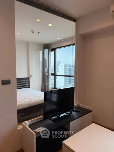 Modern apartment with bedroom view and sleek interior design in urban setting