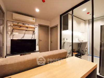 Modern living room with open kitchen and stylish decor