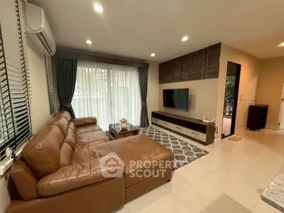 Spacious living room with leather sofa and modern decor