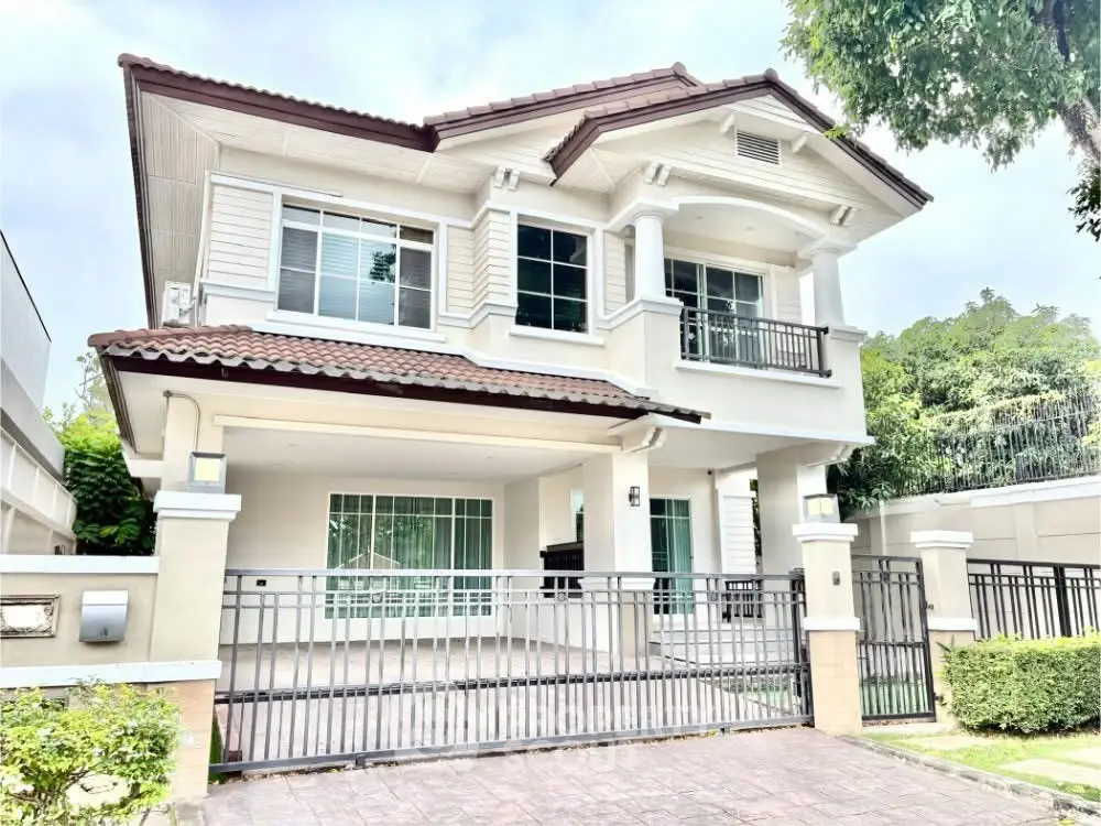 Elegant two-story house with modern design and spacious driveway in a serene neighborhood.
