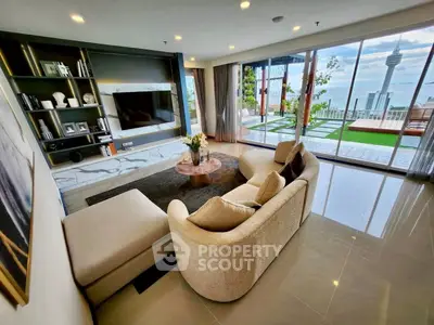 Luxurious living room with stunning city view and spacious balcony
