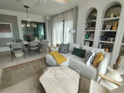Luxurious modern living room with elegant decor and open dining area