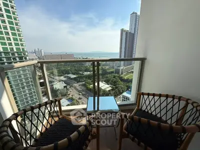 Stunning high-rise balcony with breathtaking city and ocean views.