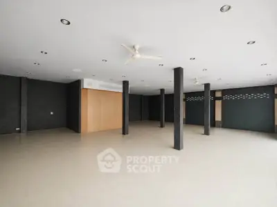 Spacious open-plan commercial space with modern design and ample natural light.