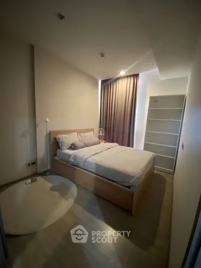 Cozy bedroom with modern furnishings and natural light