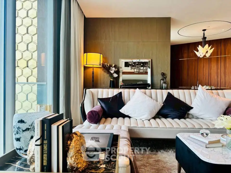 Luxurious modern living room with elegant decor and large windows