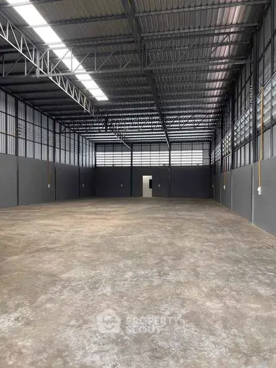 Spacious industrial warehouse with high ceilings and ample natural light
