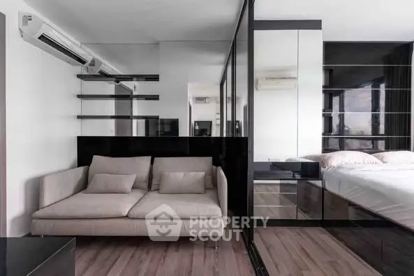 Modern apartment interior with sleek design and mirrored walls