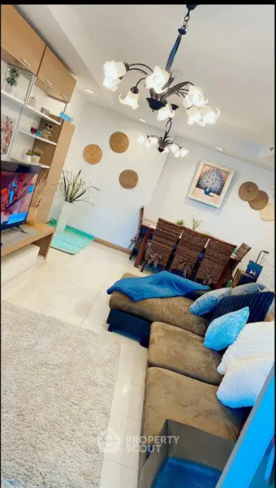 Stylish living room with cozy seating and elegant dining area, perfect for modern living.