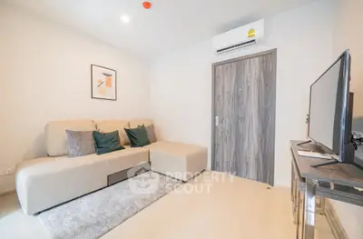 Modern living room with cozy sofa and air conditioning in stylish apartment.