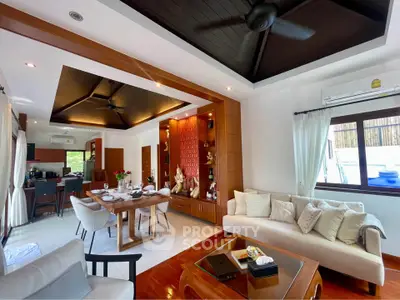 Luxurious open-plan living and dining area with elegant decor and natural light.
