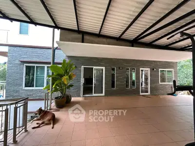 Spacious covered patio with modern design and garden view