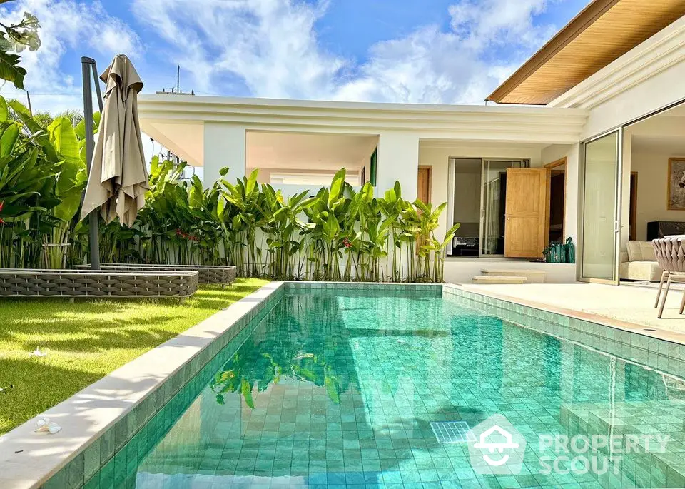 Luxurious modern villa with private pool and lush garden, perfect for relaxation and entertainment.