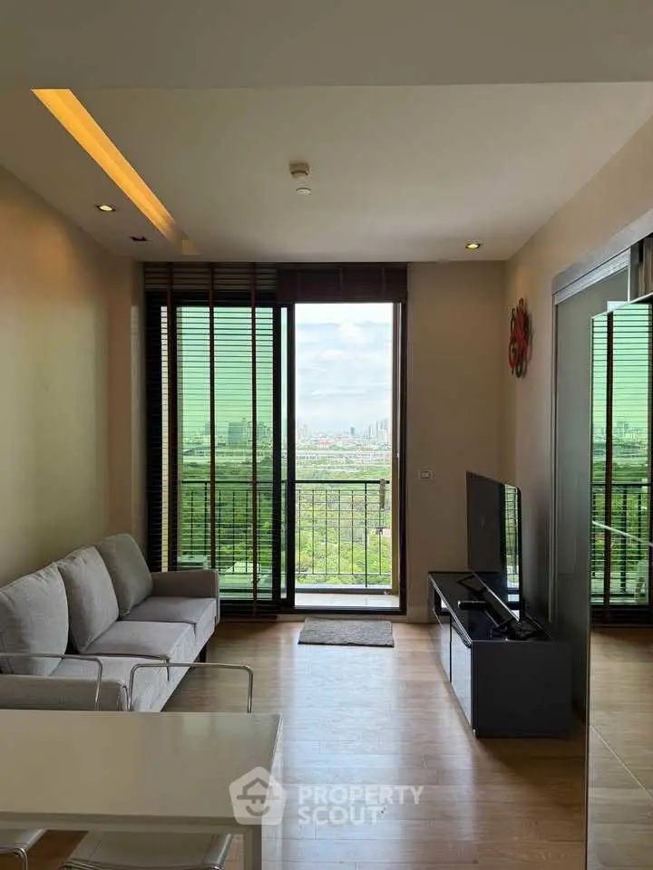 Modern living room with stunning city view and sleek furnishings