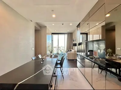 Luxurious open-plan kitchen and living room with modern design and city view.