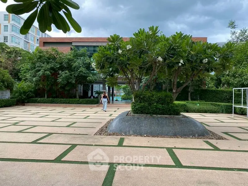 Spacious garden area with lush greenery and modern architecture