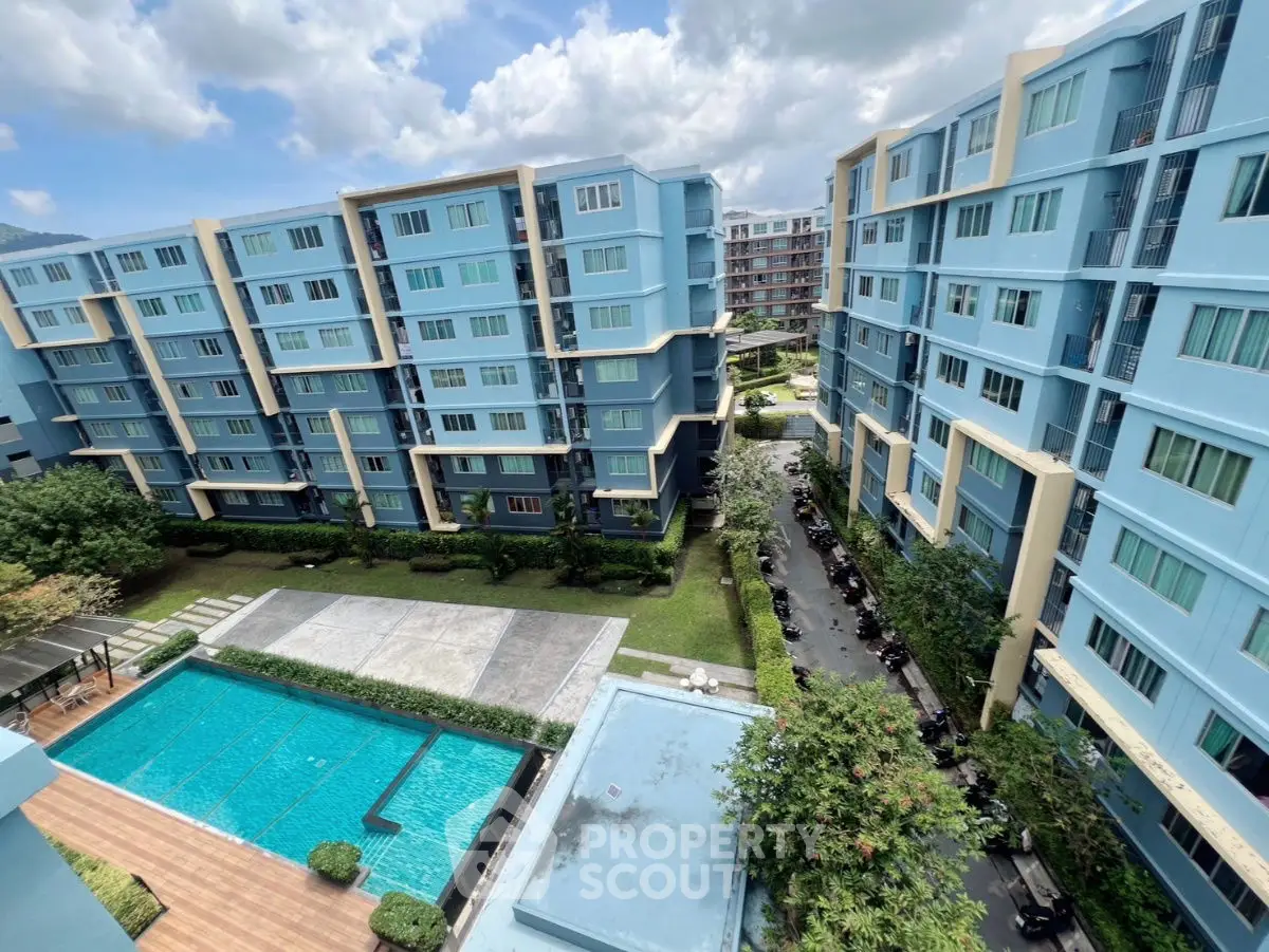 Modern apartment complex with pool and landscaped gardens, offering a serene urban living experience.