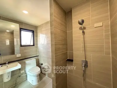 Modern bathroom with sleek tiles and contemporary fixtures