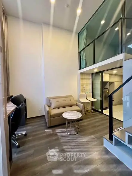 Modern loft-style living room with high ceilings and sleek design