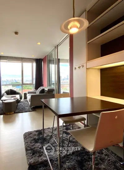 Modern living room with city view, stylish furniture, and open layout for urban living.