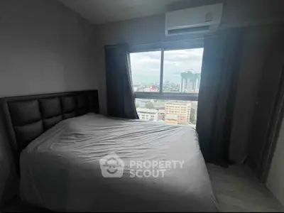 Cozy bedroom with city view and air conditioning in modern apartment