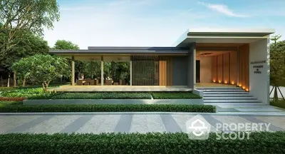 Modern clubhouse exterior with sleek design and lush greenery