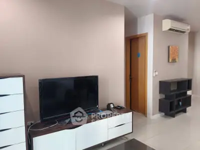 Modern living room with sleek furniture and air conditioning unit, perfect for comfortable living.