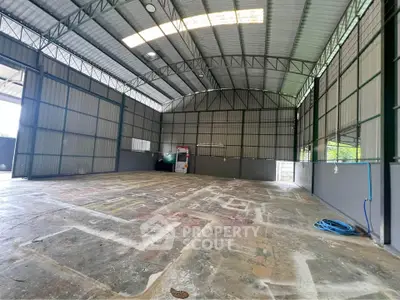 Spacious industrial warehouse with high ceilings and ample natural light
